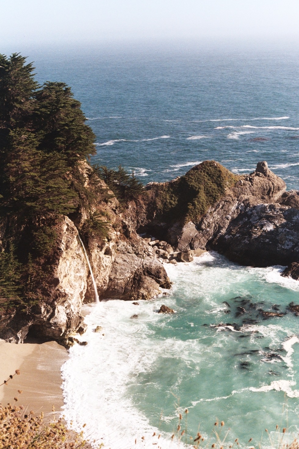 McWay Falls spilling onto a turquoise cove, Big Sur